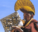 Lamas blowing conches during a service